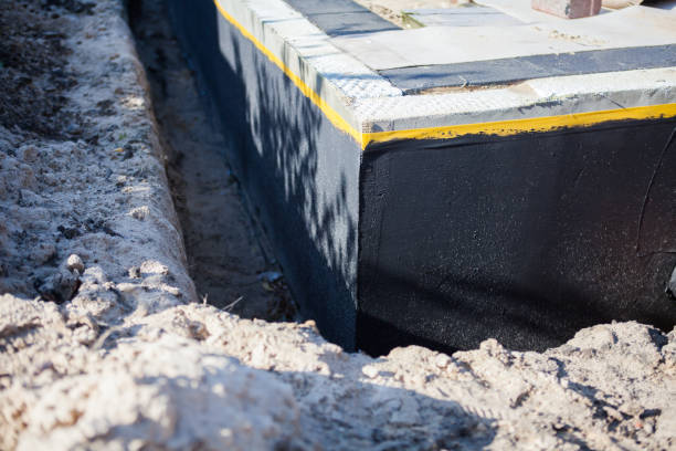 Professional Waterproofing technician working in Cleves, OH